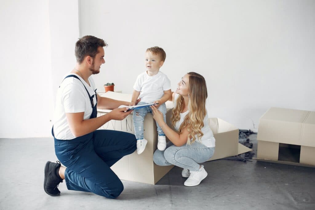 Mover helping a family with boxes