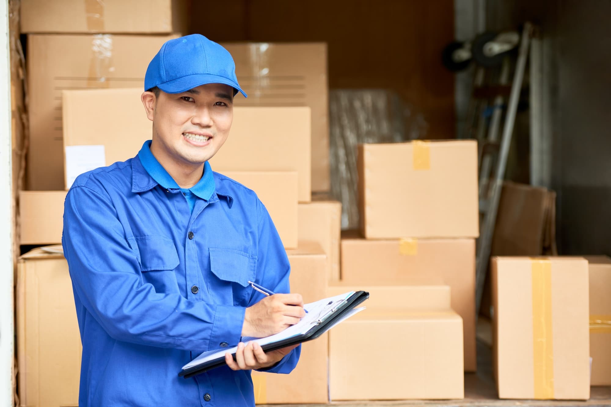 Moving company manager with a clipboard